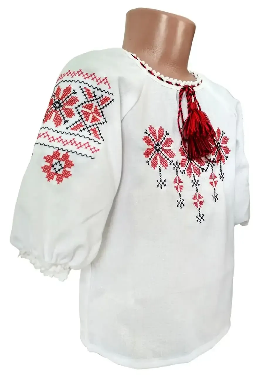 Embroidered blouse for a girl with a geometric ornament